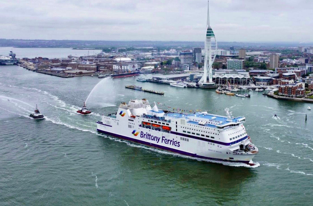 ferry leaving a city port