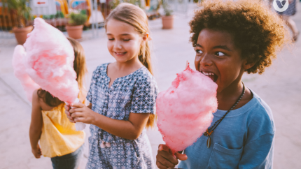 kids eating pink cotton candy