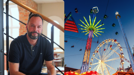 Man next to amusement park