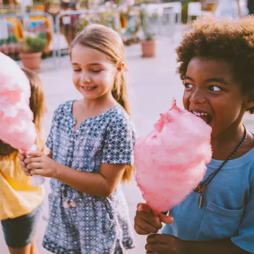 kids eating pink cotton candy