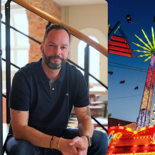 Man next to amusement park